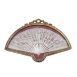 A LACE AND MOTHER OF PEARL FAN, in a giltwood ribbon tied case. 65cm wideProvenance: Rathescar