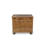 A WILLIAM AND MARY INLAID WALNUT OYSTER VENEERED CHEST, comprising two short and three long drawers,