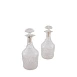 A PAIR OF CUT CRYSTAL AND SILVER MOUNTED MALLET SHAPED DECANTERS AND STOPPERS, Sheffield 1921,