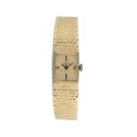 A LADY'S GOLD WATCH BY LONGINES, the rectangular gold dial with black baton markers and gilt sword