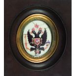 MÉDAILLON ovale orné d'une aigle bicéphale sur fond blanc Émail peint sur cuivre. Fin du XVIIIe