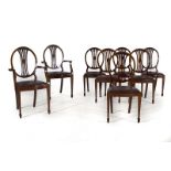 Conjunto de seis sillas y dos butacas Jorge III en madera de caoba al estilo de Hepplewhite.