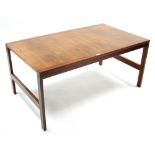 A Cado (Danish) rosewood-finish coffee table with rectangular top, & on square legs with plain