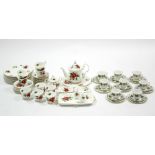 A Royal Albert bone china “Poinsettia” pattern thirty-six piece part dinner & tea service; & a Royal