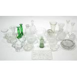 Two cut-glass square decanters; two cut-glass trumpet shaped vases; two pairs of glass candlesticks;