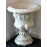 A cast reconstituted stone campana-shaped garden urn, 21" diam. x 27" high.