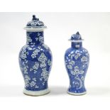 A 19th century Chinese blue & white porcelain baluster vase with lion-dog finial to the domed