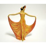 A Wade pottery figure of Pavlova in yellow/orange cellulose finish; 9¼" high.