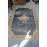 A Persian pattern small carpet of blue & ivory ground with geometrical design to border within a