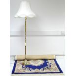 A modern Chinese rug of deep blue & ivory ground, & with floral medallion to centre within a wide