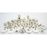 Seventy-four various items of crested china.