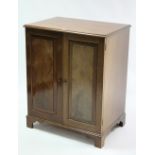 A 19th century-style small standing cabinet with fitted interior enclosed by hinged lift-lid &