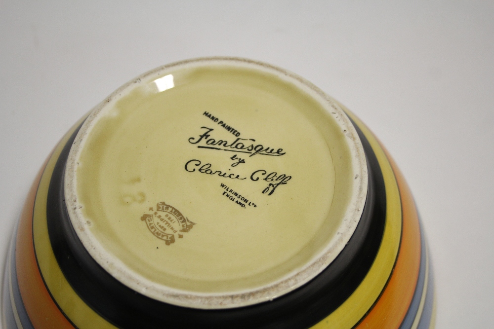 A Clarice Cliff “Fantasque” deep bowl painted with coloured horizontal bands to the exterior, 8½” - Image 6 of 8