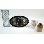 An oriental-style black lacquered frame oval wall mirror with figure & bird decoration to border &