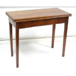 A 19th century mahogany tea table with rectangular fold-over top, & on square tapered legs, 35¾"