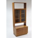 A Beithcraft of Scotland teak tall standing cabinet, the upper part fitted two shelves to centre