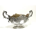 A LATE VICTORIAN LARGE OVAL BOWL with cast & pierced dolphin scroll side handles, shaped rim, all-