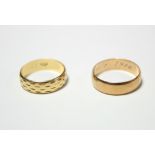A continental gold (585) patterned band with engraved date 1906; & an Austrian plain wedding band,