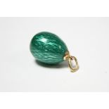 A FABERGE MINIATURE PENDANT EGG entirely covered in green guilloche enamel, the gold suspension loop
