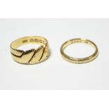 An Edwardian 18ct. gold ring, Birmingham 1902; & an 18ct. gold narrow band with engraved design,