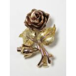 An Austrian two-colour gold (585) brooch modelled as a rose & bud. (5.6gm).