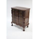 A colonial-style small hardwood chest fitted five long drawers with brass swing handles, & on