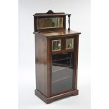 A 19th century rosewood sheet-music cabinet, inset bevelled rectangular mirror to the stage-back,