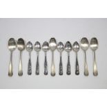 A set of six eastern silver teaspoons with different picture scene design to stems; & a part set