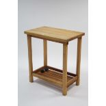 A maple-finish rectangular two-tier kitchen island on square supports (lacking two castors), 30"