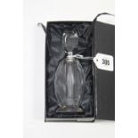 A modern cut-glass scent bottle in the art deco style, 6¾” high, cased.