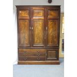 A VICTORIAN FIGURED MAHOGANY COMBINATION WARDROBE with hanging compartment & shelves to top enclosed
