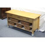 A maple-finish side cabinet fitted three frieze drawers above two open recesses, each fitted with