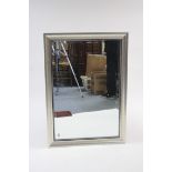 A large rectangular wall mirror inset bevelled plate, & in silvered-finish frame, 29" x 41¼"; &