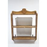 A set of pine hanging wall shelves of three open tiers, & with shaped end supports, 30" wide x