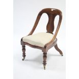 A Victorian walnut occasional chair with shaped splat to the open back, with sprung seat, & on short