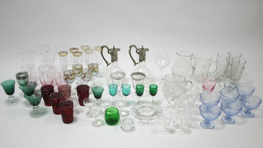 Two modern clear glass claret jugs with plated mounts; various coloured & clear drinking glasses,