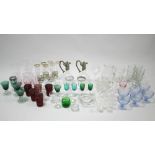 Two modern clear glass claret jugs with plated mounts; various coloured & clear drinking glasses,