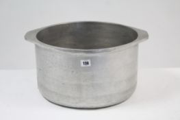 A stainless steel circular two-handled pot, 14½" diam; together with twelve small pictures.