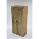 A pine small upright cupboard fitted three shelves enclosed by pair of panel doors, 23" wide x 48"