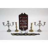 A pair of brass ejector candlesticks, 7¾" high; a set of six horse brasses; a brass-handled