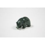 A miniature jade ornament in the form of a standing bear with a fish in its mouth, 1¼” wide, 3¼”