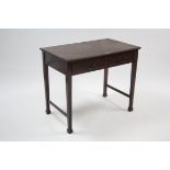 A Heal & Sons of London mahogany side table, fitted two frieze drawers & on square tapered legs with