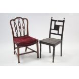 A late Victorian mahogany hall chair with carved & open back, hard seat, & on ring-turned tapered