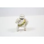 A reproduction painted cast-iron “Michelin” man advertising figure, 6” high.