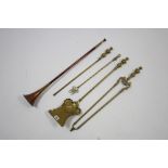 A set of three brass fire implements; a brass toasting fork; & a copper & brass hunting horn, 28¾”