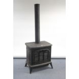 A Gazco gas stove in black-finish cast-iron case, 25” wide x 63” high.