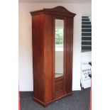 A late Victorian walnut narrow wardrobe enclosed by rectangular mirror door to centre, & on shaped
