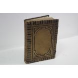 A Victorian leather-bound family photograph album containing approximately ninety various
