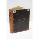 A leather scrapbook containing numerous hand-written entries from 1856-1920, together with various