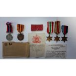 A group of four World War Two medals, un-named as issued; 1939-45 Medal, Africa Star, Italy